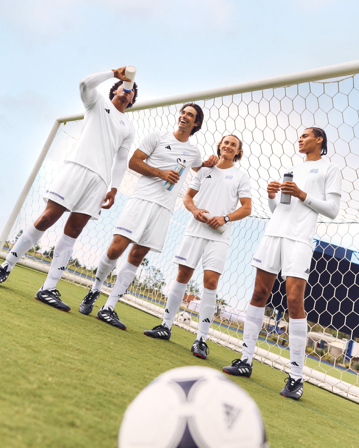 Team White soccer players in coordinated white uniforms
