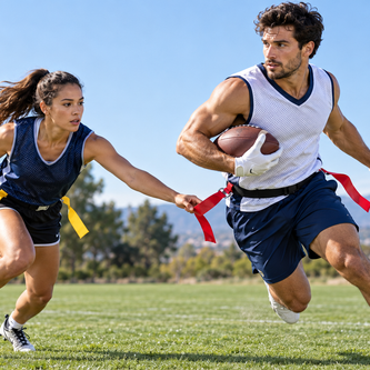 Adult athletes playing flag football in performance jerseys