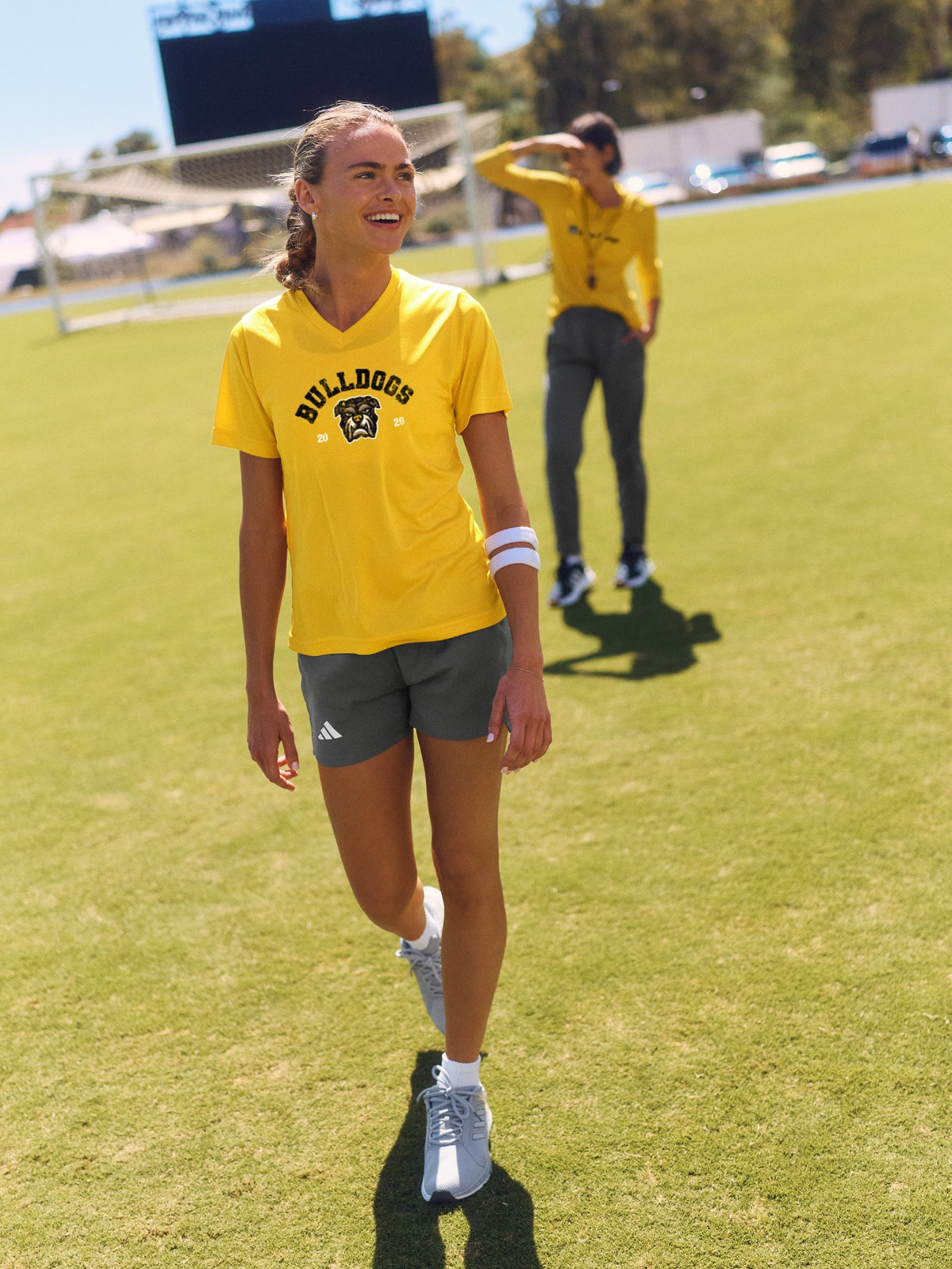 Athletes in gold team apparel