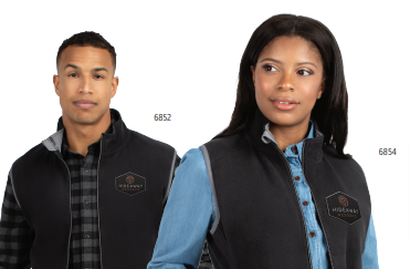 A man and a woman wear black CHILL FLEECE VEST 2.0 jackets made from recycled polyester with crest logos over button-up shirts. The man looks ahead, the woman to the side. Product numbers 6852 and 6854 appear by each person.