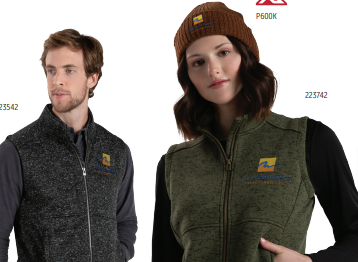 A man and a woman wear ALPINE SWEATER FLEECE VESTS with an embroidered yellow and blue logo—hers is olive green in a ladies fit, paired with a brown knit beanie; his is dark gray. Both vests are made from recycled polyester.
