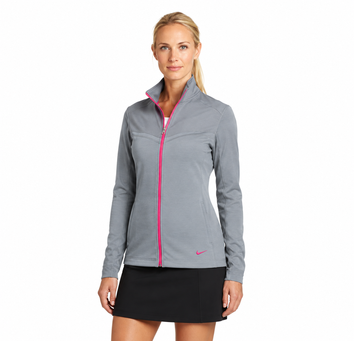 Front view of a model wearing the gray Nike Therma-FIT jacket with pink zipper
