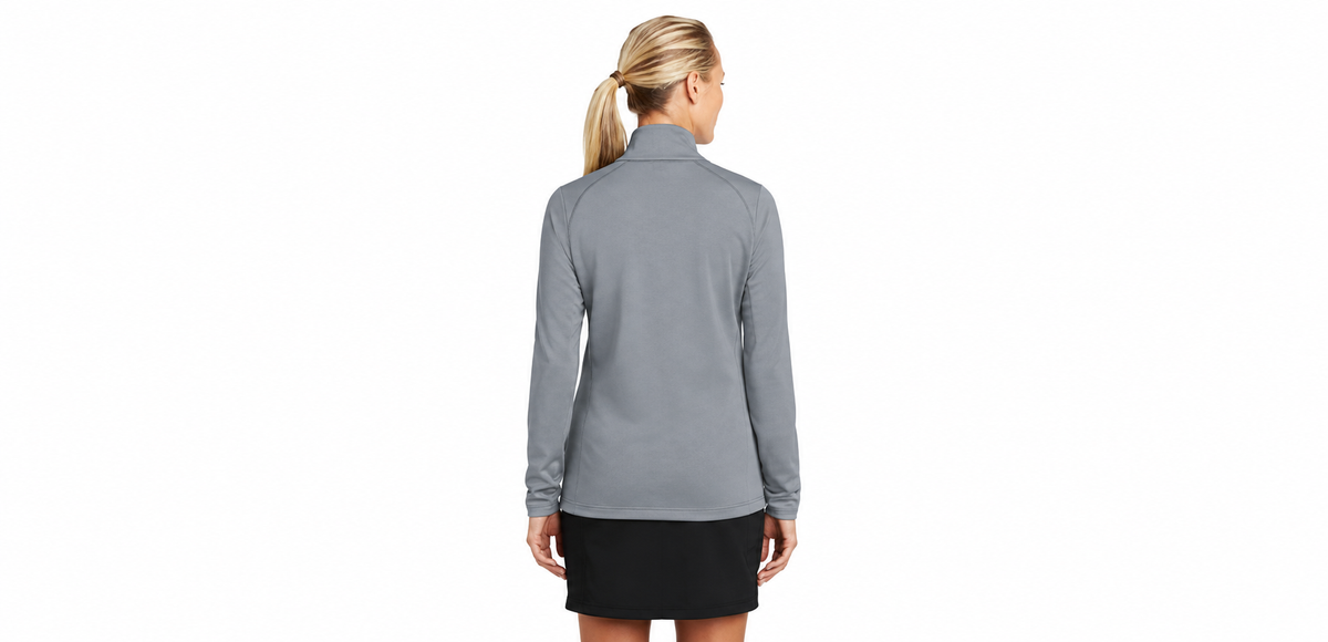 Rear view of a model wearing the gray Nike Therma-FIT full-zip jacket