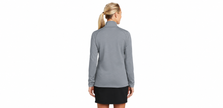 Rear view of a model wearing the gray Nike Therma-FIT full-zip jacket
